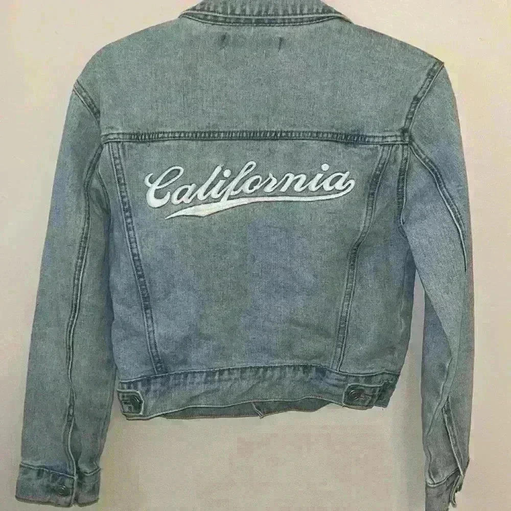 Forever 21 denim jacket in a size small with California on the back.